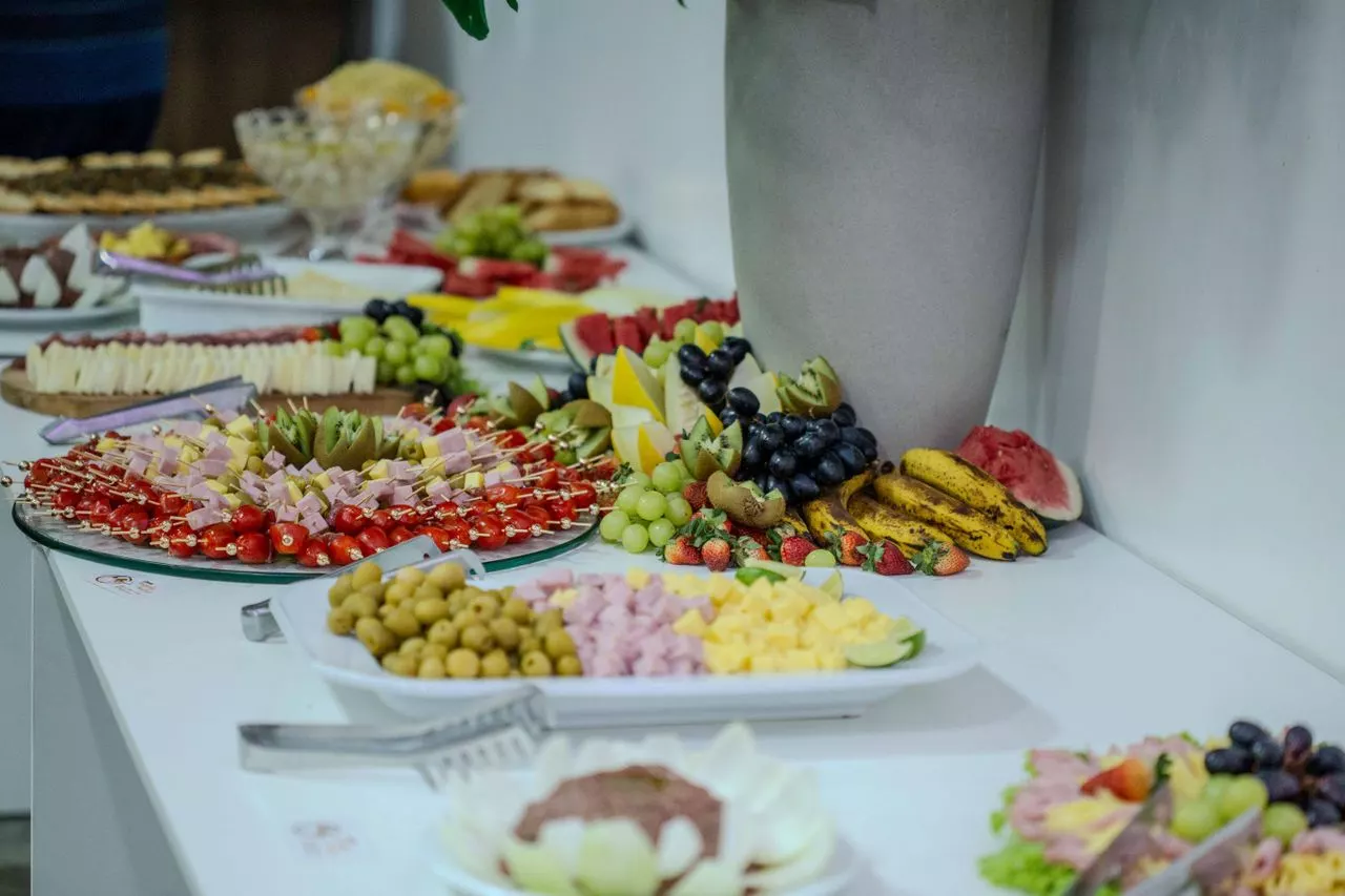 Gourmet buffet with fruit displays, cheese boards and canapé platters