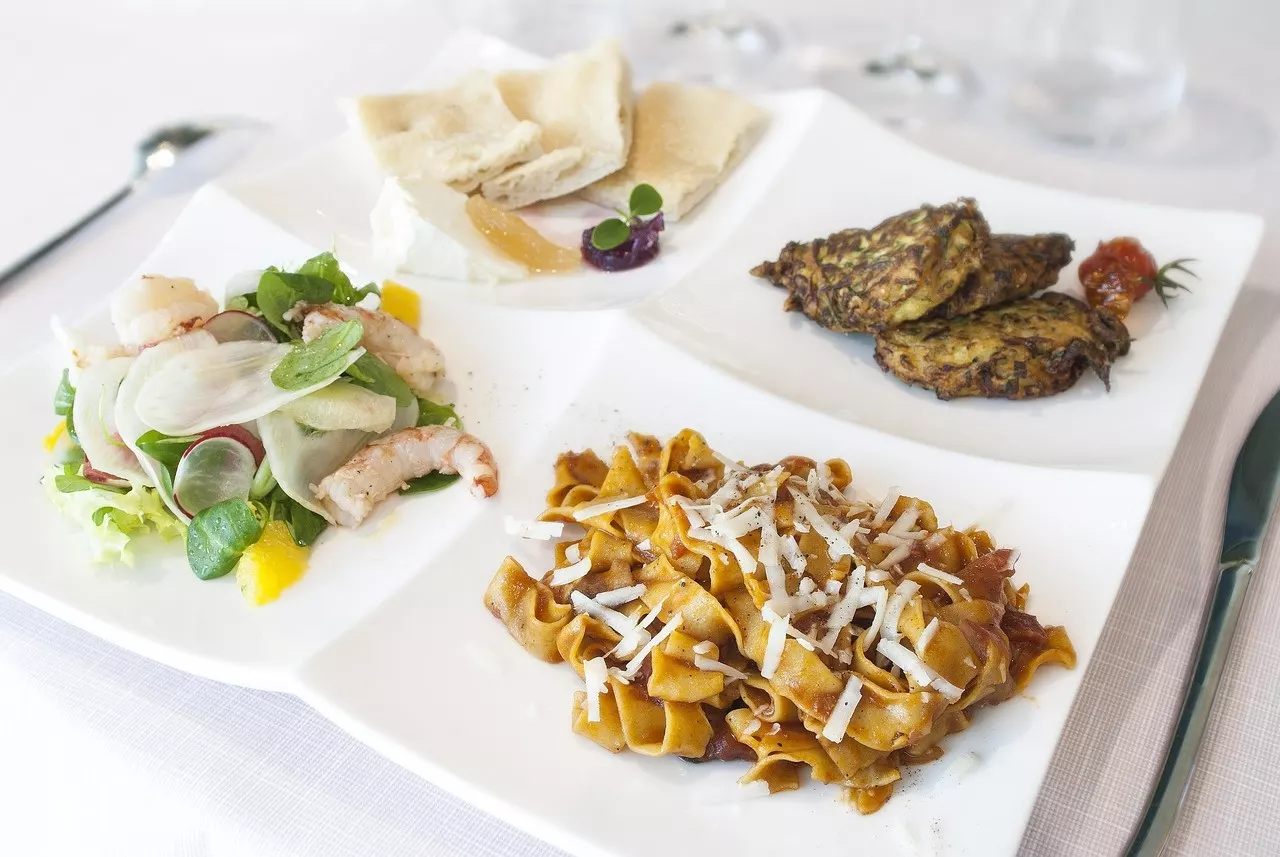 Corporate catering spread with plated dishes